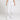 Front angle Model shot of female in Intensity Softball Knit Pant in color WHITE